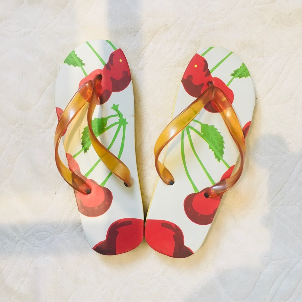Pomegranate design yellow slippers.